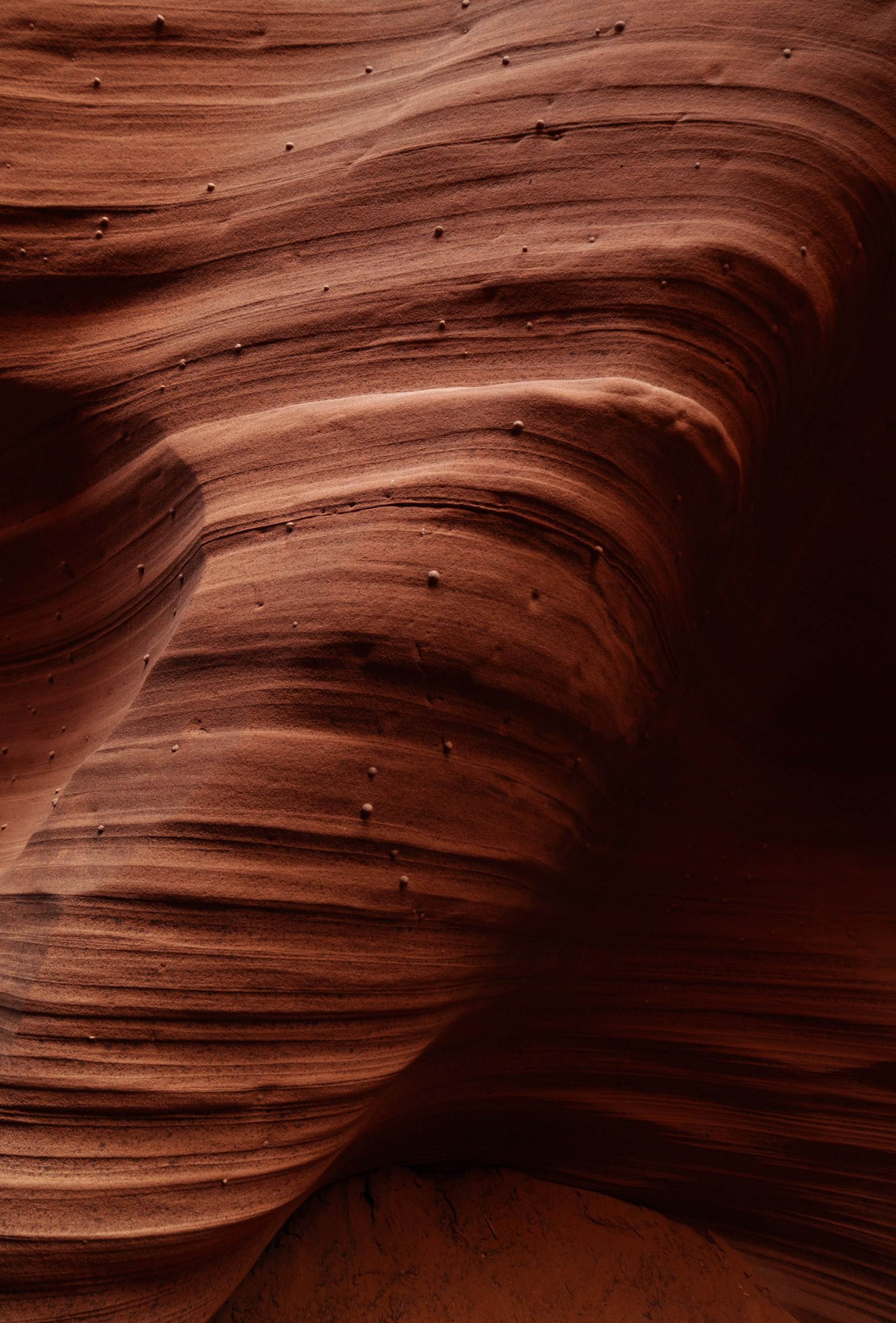 Layered sandstone, the kind of formation a borehole is drilled through